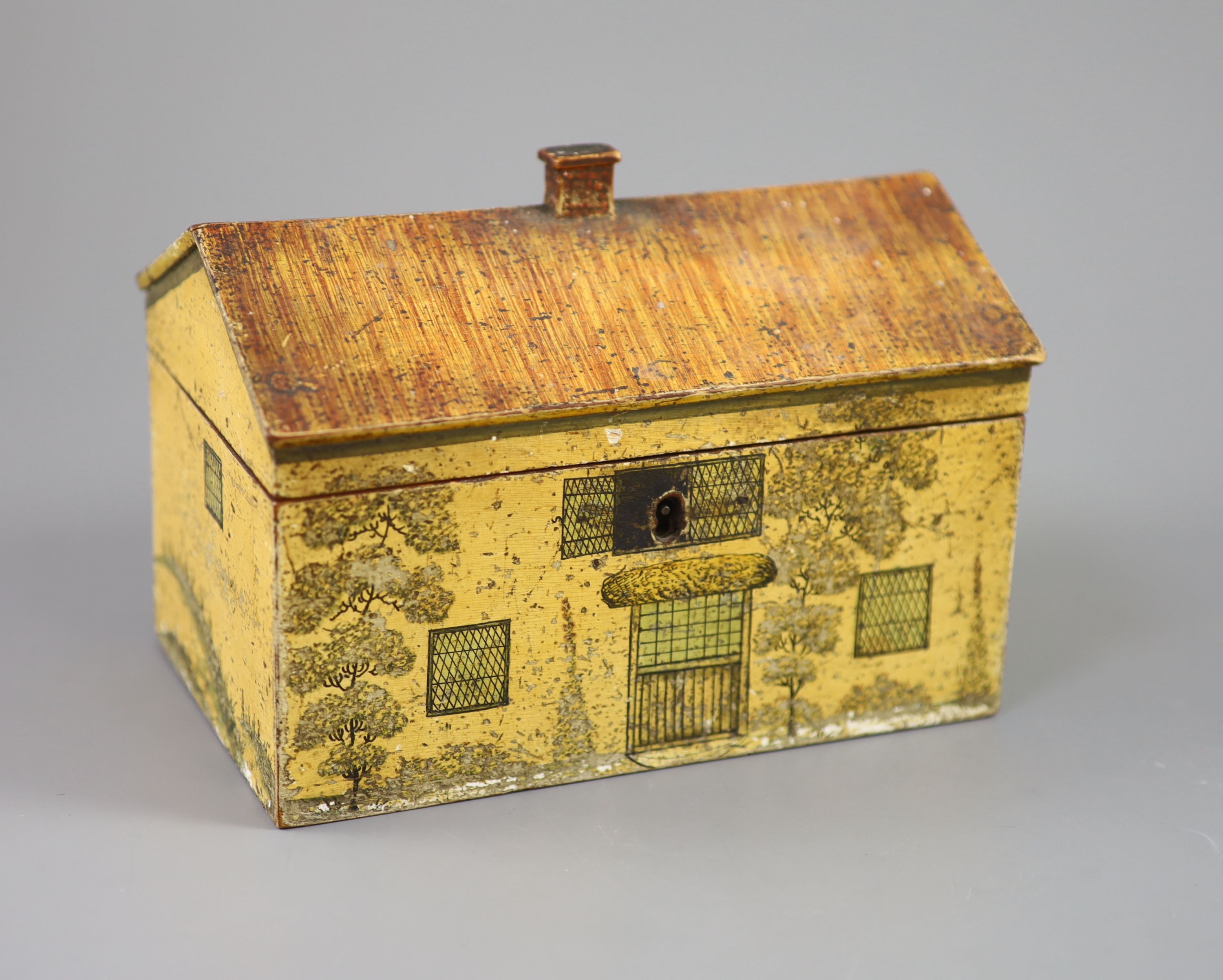 A Regency painted and penwork work box, modelled as a cottage, width 7.25in. depth 4.5in. height 5in.